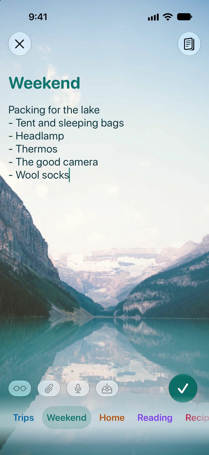A packing list for the lake in a rounded font on a photo of a mountain lake.